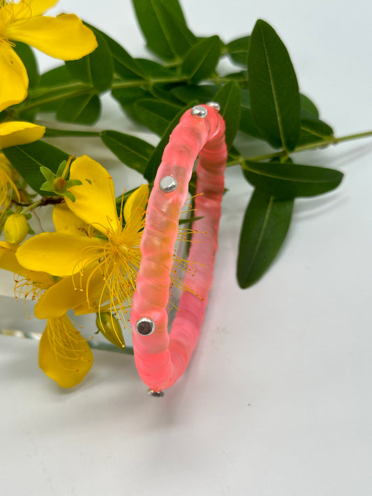 Translucent Coral resin and sterling silver rivet 'simple twist' classic bangle