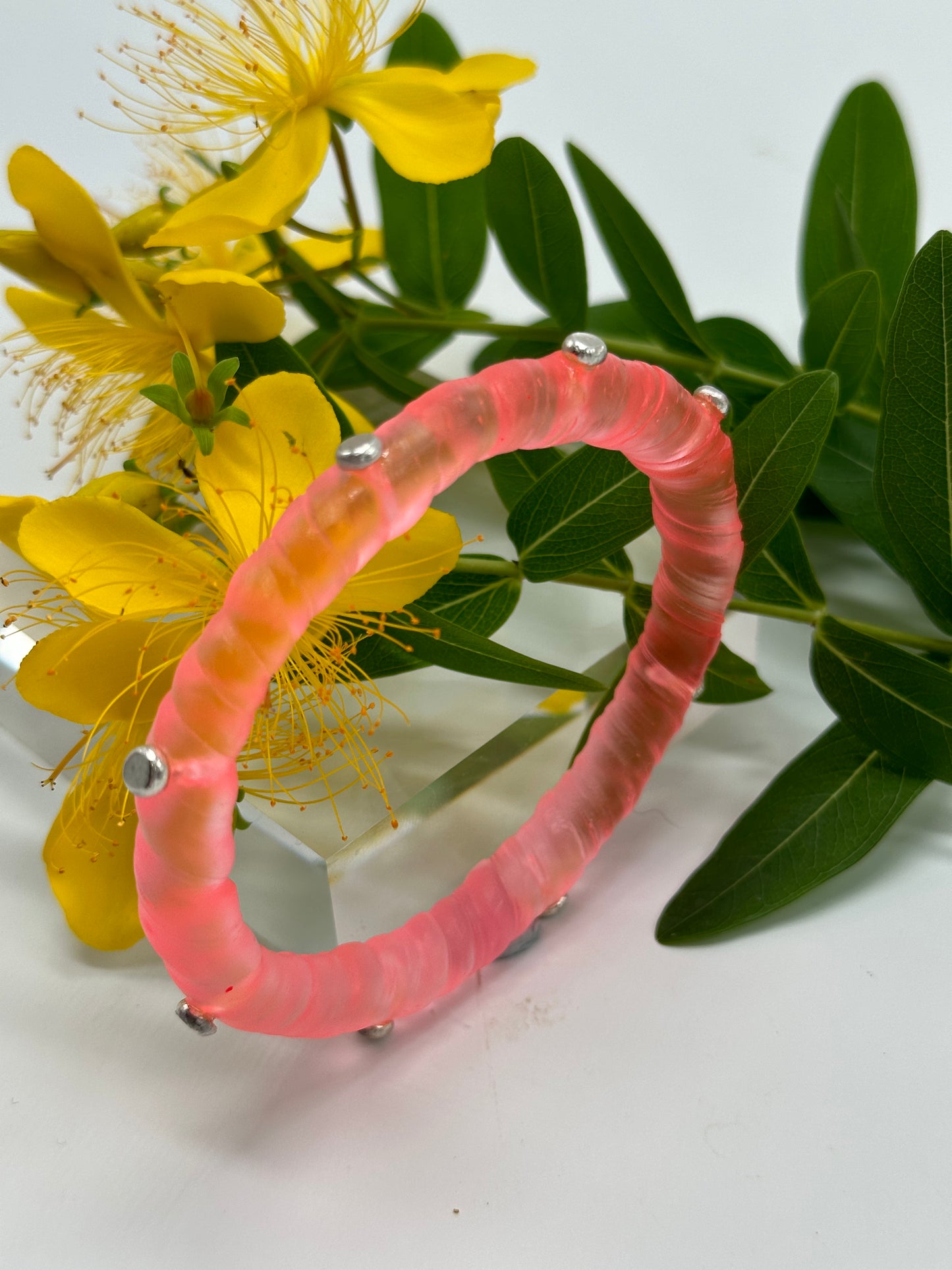 Translucent Coral resin and sterling silver rivet 'simple twist' classic bangle