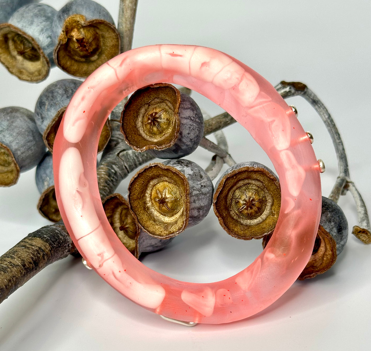Translucent Coral with white swirl woopy bangle
