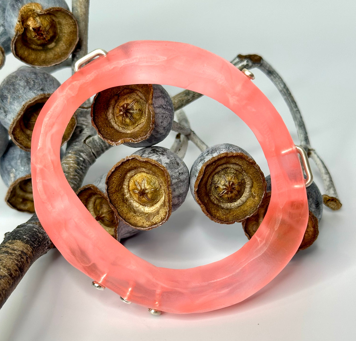Translucent Coral with white swirl woopy bangle