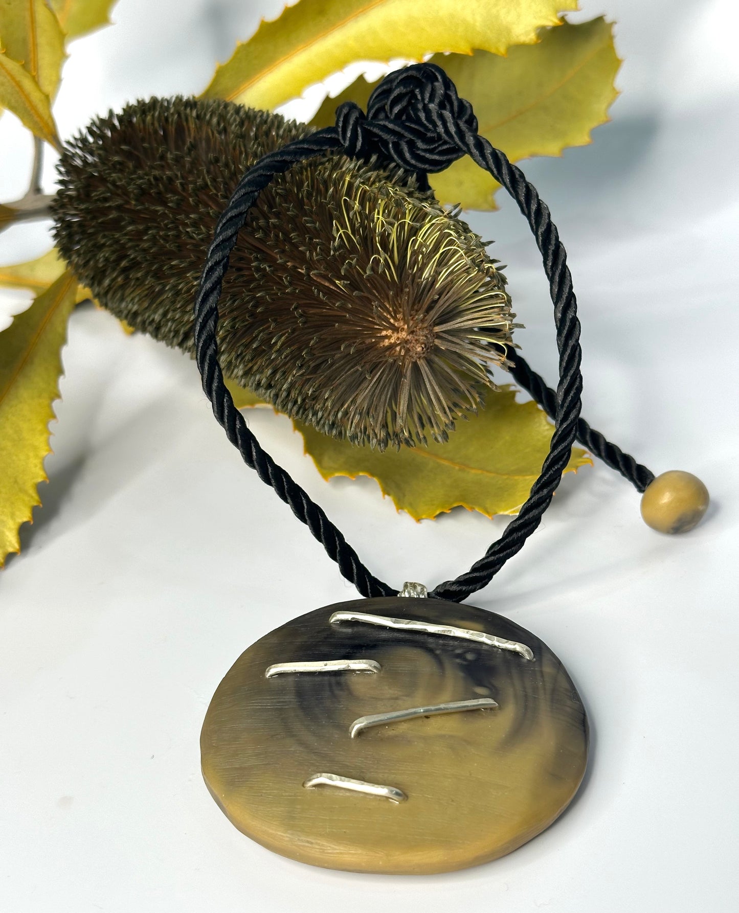 Tan/Black Round Pendant & silver necklace